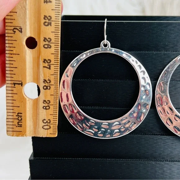 Gorgeous weighted Silvertone modernist hammered circle pierced earrings